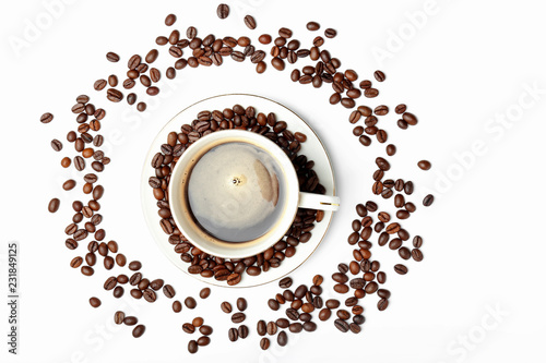 Cup of coffee and roasted beans on white background