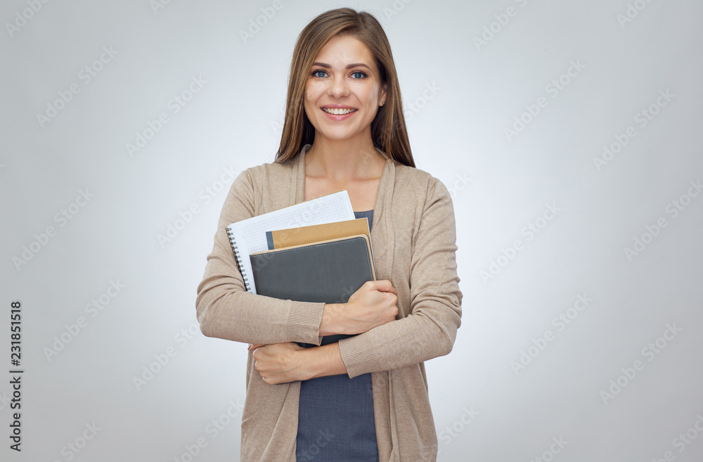 Happy shcool teacher holding books. Happy shcool teacher holding books.