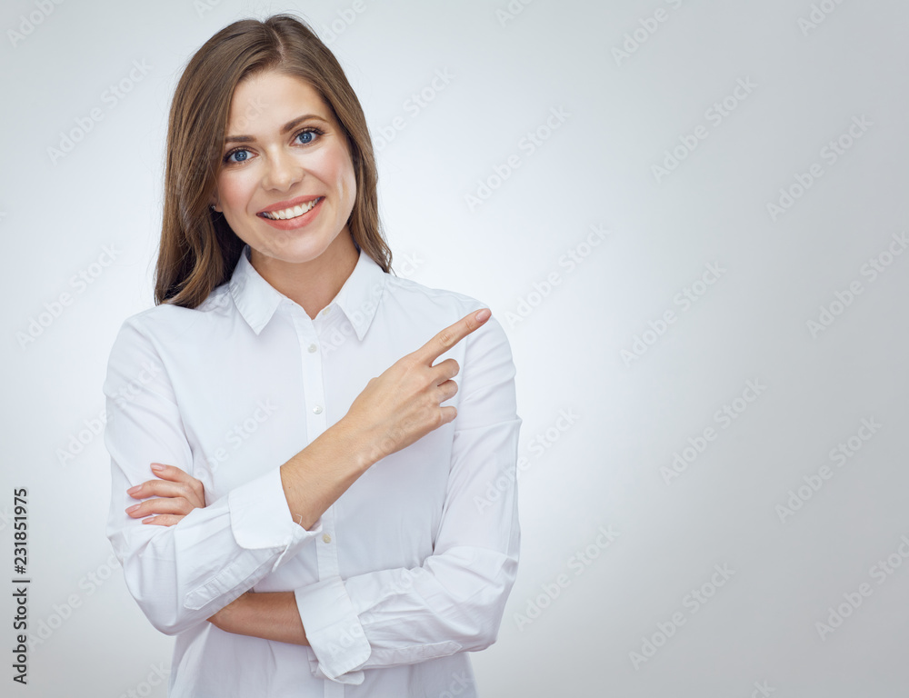 Happy business woman pointing with finger at copy space. Happy business woman pointing with finger at copy space.