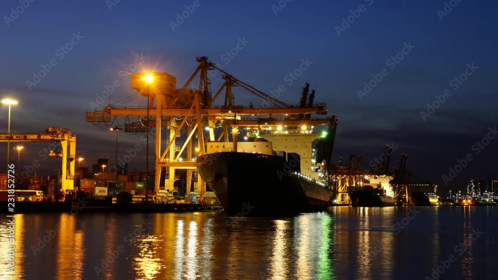 BANGKOK, THAILAND - 28 October 2018 :Time Lapse of big crane loading and unloading container from port of Bangkok to container cargo freight ship at sunrise time BANGKOK, THAILAND - 28 October 2018 :Time Lapse of big crane loading and unloading container from port of Bangkok to container cargo freight ship at sunrise time