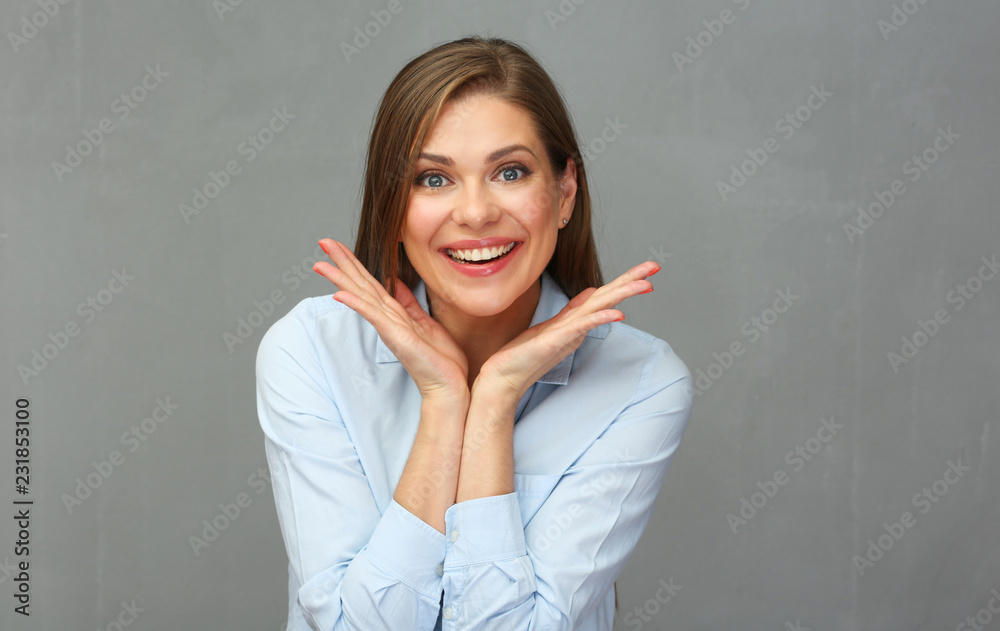 Close up portrait of smiling woman with arms. Grey wall background. Close up portrait of smiling woman with arms. Grey wall background.