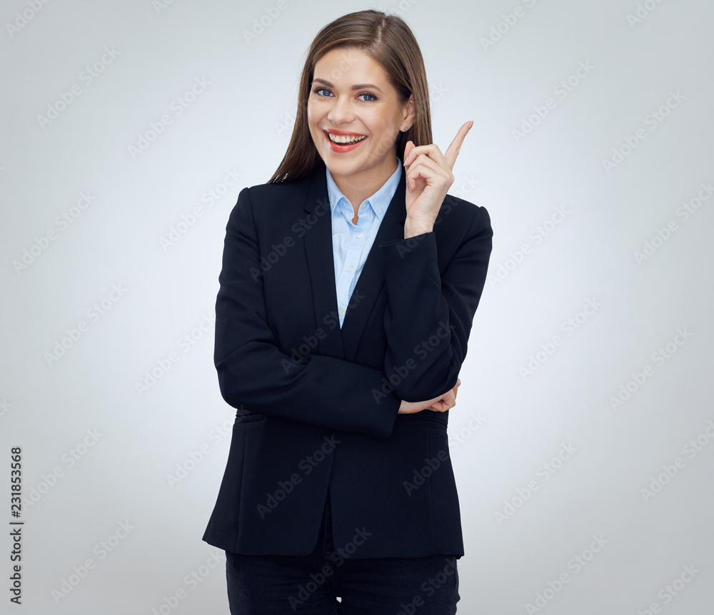 Business woman wearing black suit pointing finger at copy space Business woman wearing black suit pointing finger at copy space