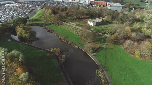 Aerial footage of  Provan Hall, a medieval fortified country house, surrounded by trees in Auchinlea Park in Glasgow. photo