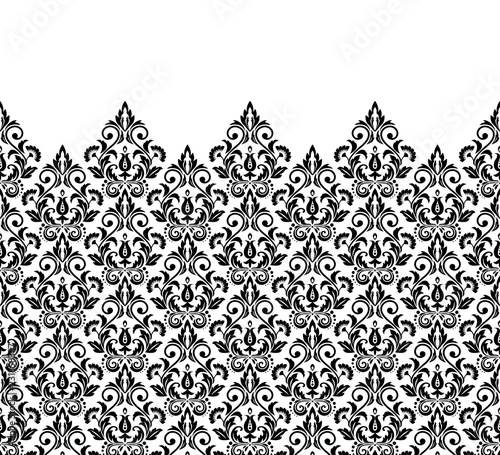 Wallpaper in the style of Baroque. Seamless vector background. White and black floral ornament. Graphic pattern for fabric, wallpaper, packaging. Ornate Damask flower ornament