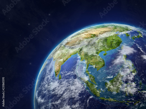 Asia on model of planet Earth with very detailed planet surface and clouds.