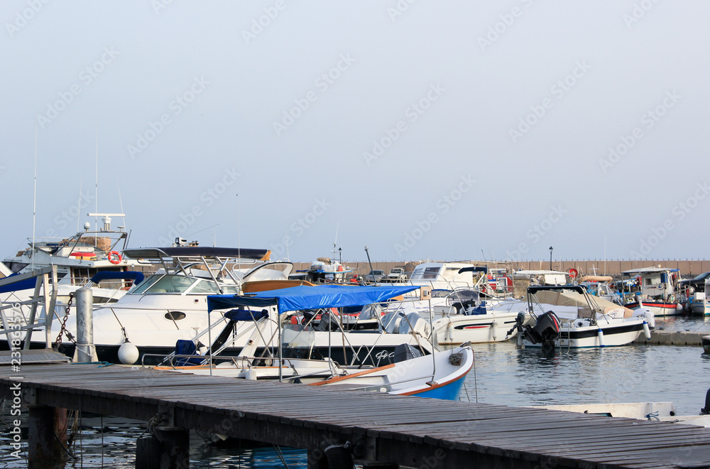 Fototapeta premium White yachts parked at the pier at sunny day