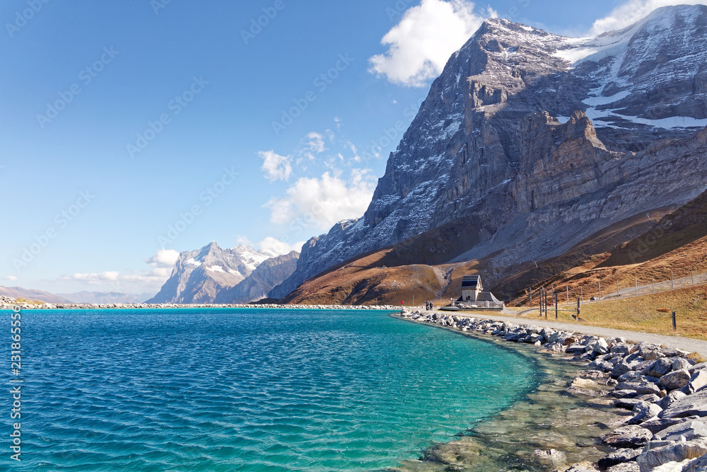 Fototapeta premium View of Eigernordwand (Eiger Northface) and Wetterhorn massif from Fallboden station and Fallbodensee (Fallboden lake) - Fallboden, Jungfrau Region, Switzerland