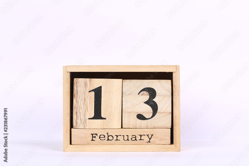 Wooden cubes calendar with the date of February 13. Concept calendar for year with copy space isolated on white background Wooden cubes calendar with the date of February 13. Concept calendar for year with copy space isolated on white background