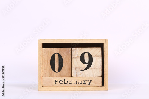 Wooden cubes calendar with the date of February 09. Concept calendar for year with copy space isolated on white background