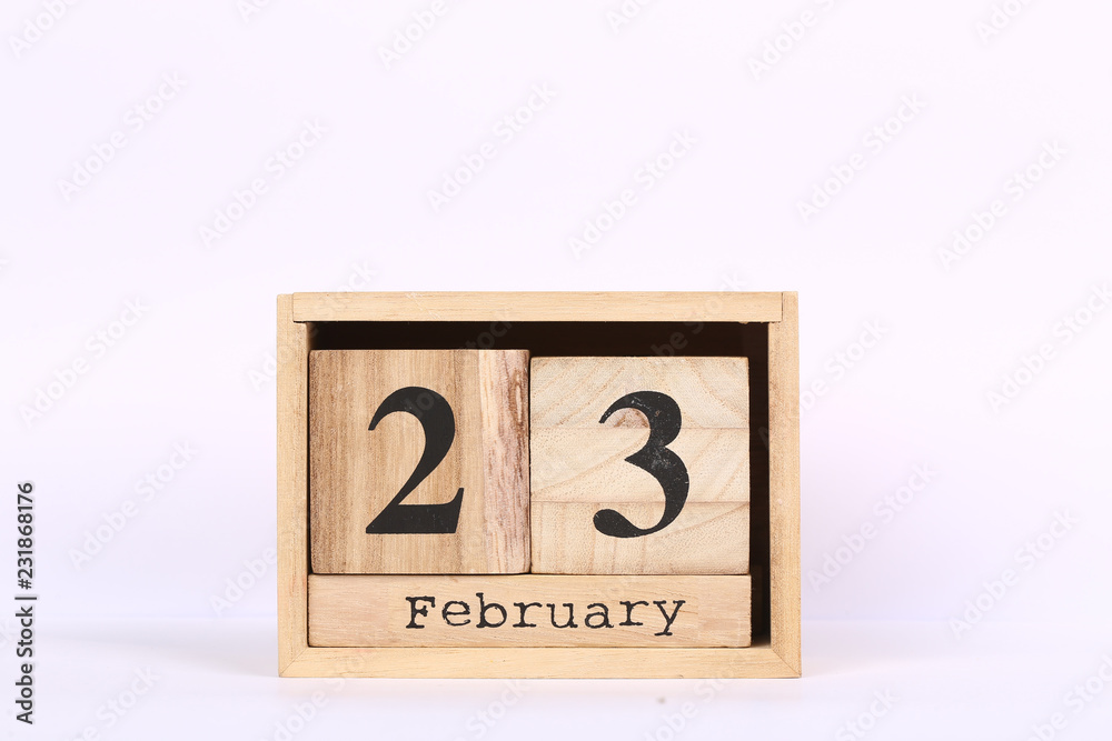 Wooden cubes calendar with the date of February 23. Concept calendar for year with copy space isolated on white background Wooden cubes calendar with the date of February 23. Concept calendar for year with copy space isolated on white background