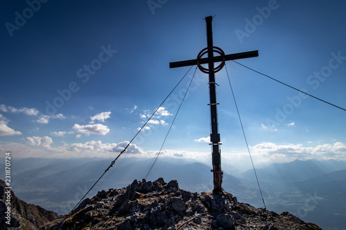 Panoramic view with a cummit cross from a mountain in the Karwendel Mountain Range near Innsbruck, Tyrol, Austria
