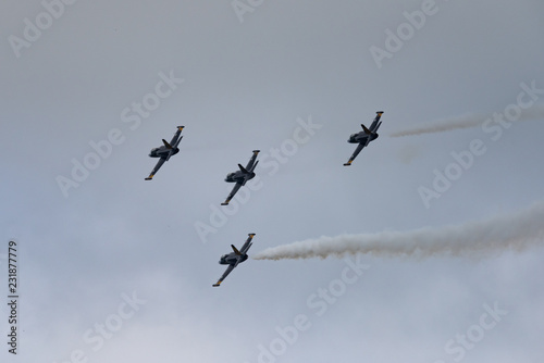 Low angle view of airshow in cloudy sky © faustasyan