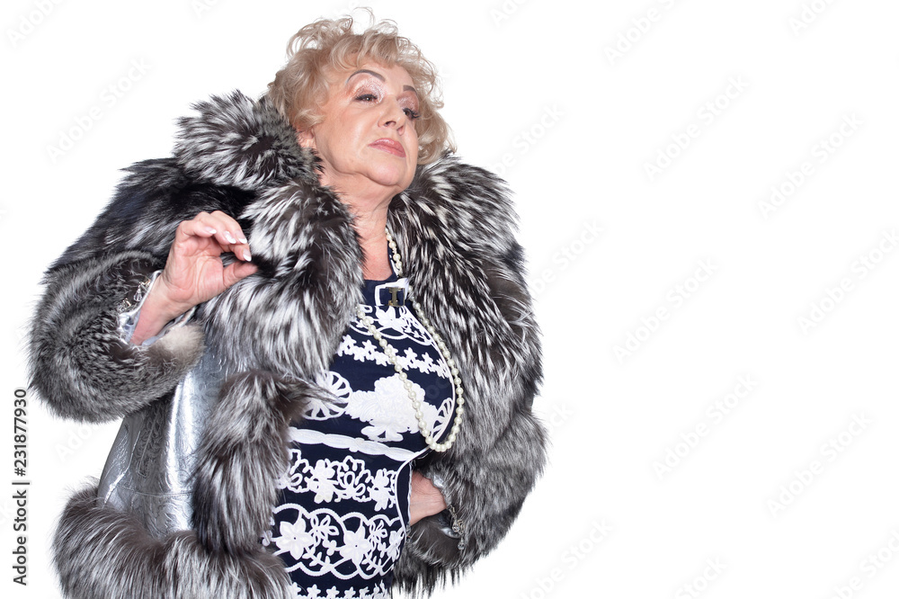Portrait of a senior woman in fur coat posing Portrait of a senior woman in fur coat posing