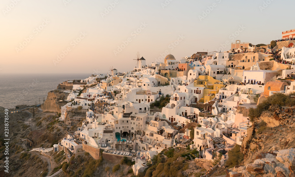 sunset on the island of Santorini, view of the Oia.
