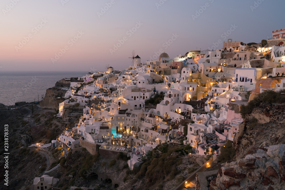 sunset on the island of Santorini, view of the Oia.