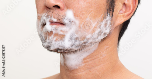 Unknow asian man shaving his beard