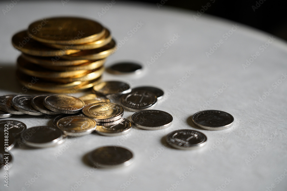 Macro shot detail of golden and silver color coin stacks on dark background with copy space for text. Business and finance growth, saving money, investment and interest concept. Macro shot detail of golden and silver color coin stacks on dark background with copy space for text. Business and finance growth, saving money, investment and interest concept.