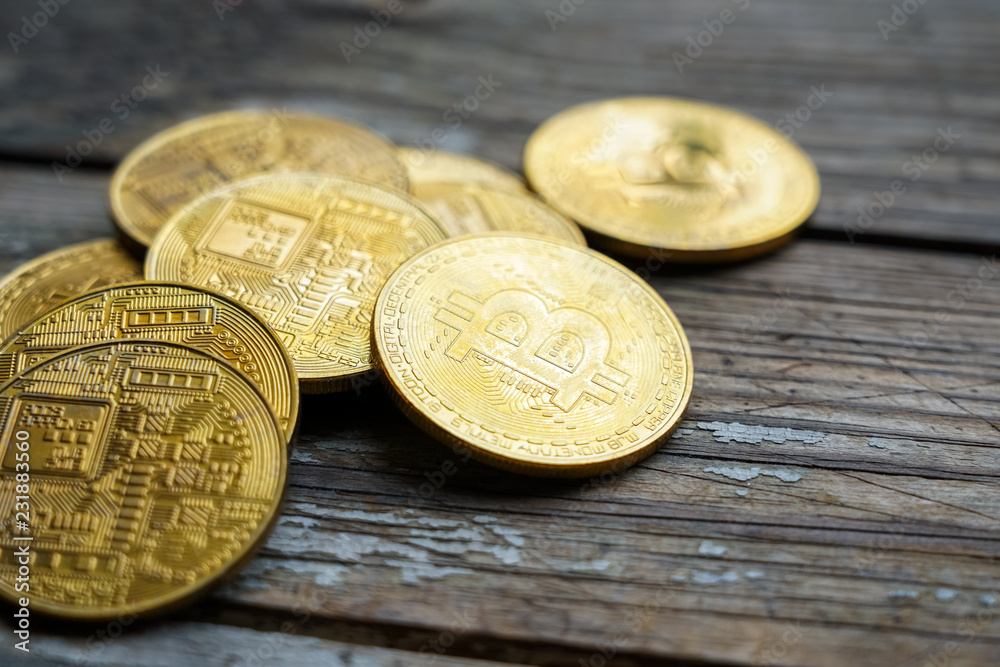 Gold Bitcoin money on wooden table. Electronic crypto currency Gold Bitcoin money on wooden table. Electronic crypto currency