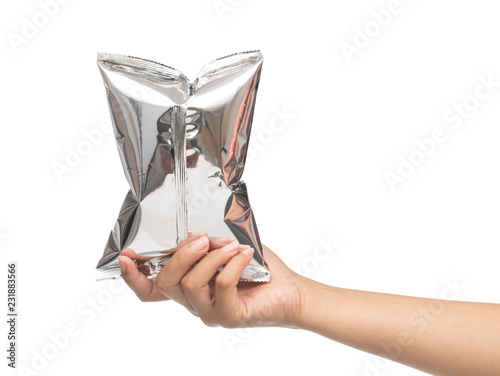 hand holding plastic bag snack packaging isolated on white background photo