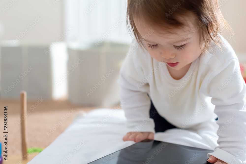 Toddler boy with a tablet computer device Toddler boy with a tablet computer device
