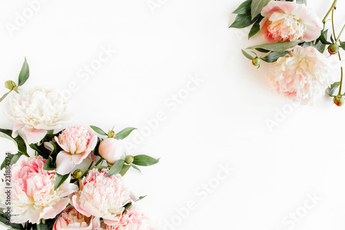 Fototapeta Naklejka Na Ścianę i Meble -  Border frame made of pink and beige peonies flower and isolated on white background. Flat lay, top view. Frame of flowers.