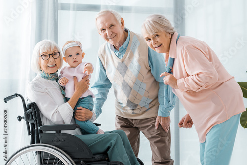 happy senior people with toddler in nursing home © LIGHTFIELD STUDIOS