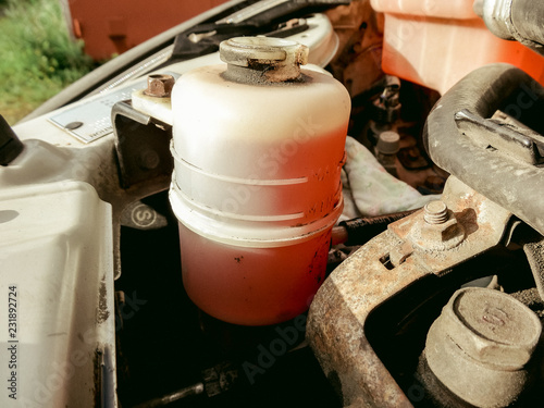 Replacing vehicle red power steering fluid