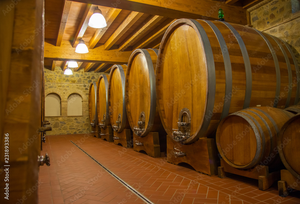 Old wooden barrels with wine