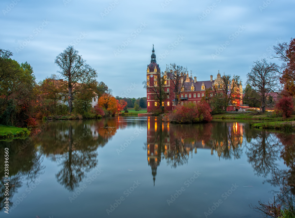 Picturesque scenery of Muskau Castle in famous Muskau Park at autumn evening, Germany. UNESCO World Heritage Site