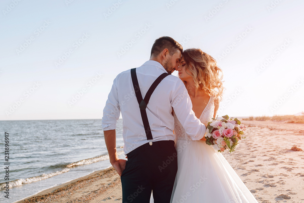 bride and groom on the seashore. wedding concept on the sea, on a fabulous island.