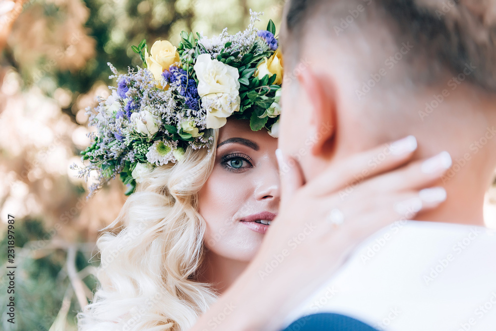 Obraz premium the bride and groom on a walk before the wedding banquet in the fairy forest near the castle. concept of love and creating a new family.