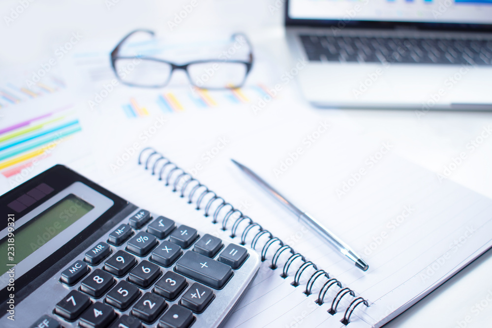 Close up of calculators, charts, graphs and numbers. In the concept of data collection and statistical work. Close up of calculators, charts, graphs and numbers. In the concept of data collection and statistical work.