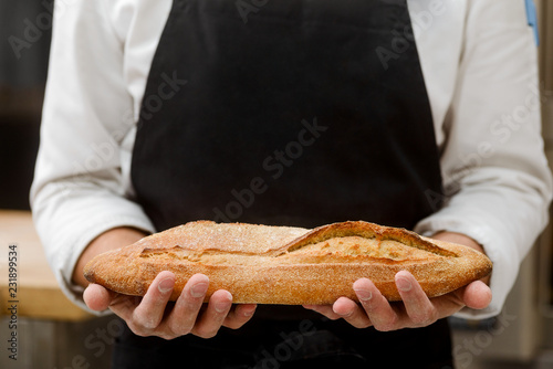 Baker demonstating his fresh bread photo