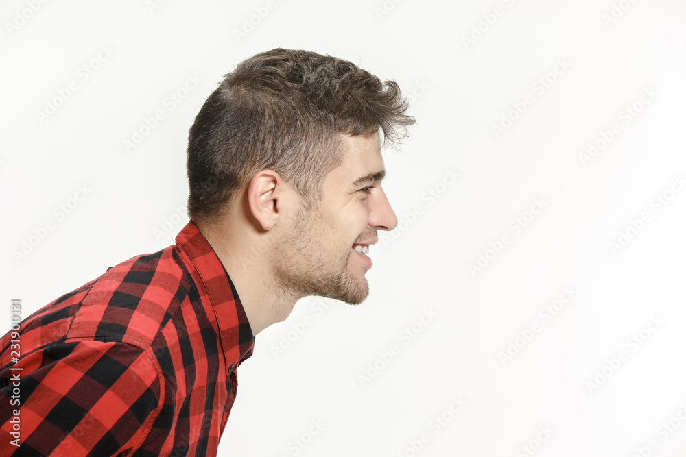 Happy business man standing and smiling isolated on pink studio background. Beautiful male half-length portrait. Young emotional man. The human emotions, facial expression concept. Profile Happy business man standing and smiling isolated on pink studio background. Beautiful male half-length portrait. Young emotional man. The human emotions, facial expression concept. Profile
