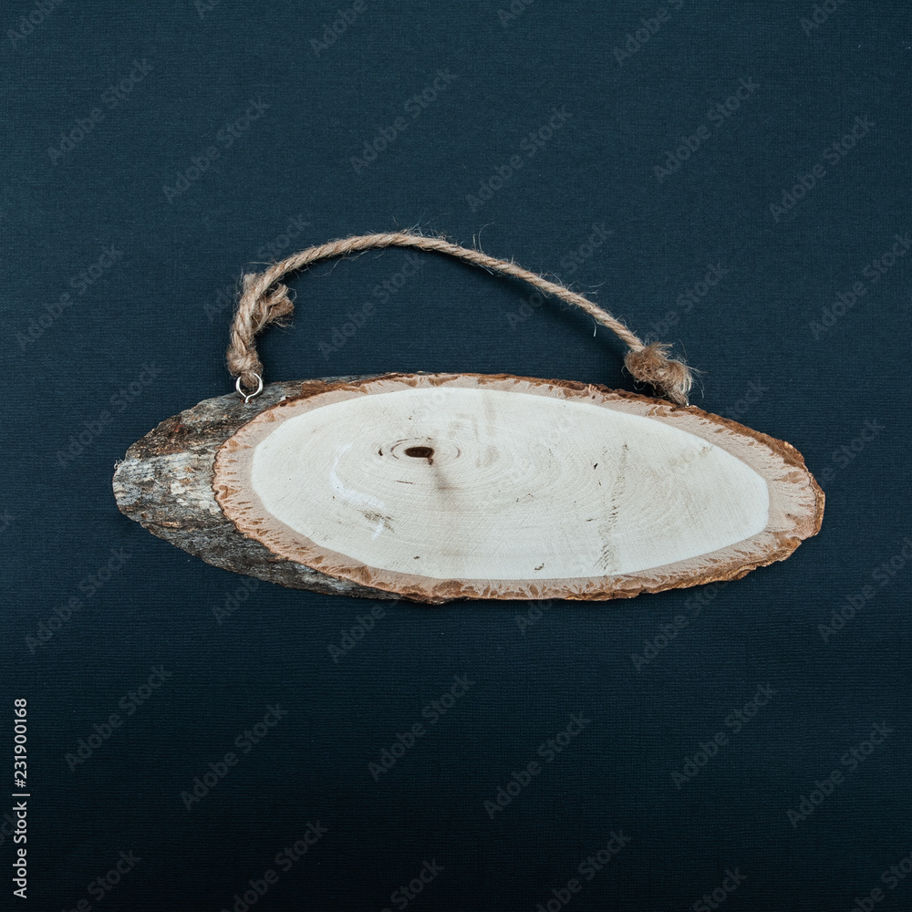 Wood rustic signboard on an black background. View from above, flat lay , space for text Wood rustic signboard on an black background. View from above, flat lay , space for text
