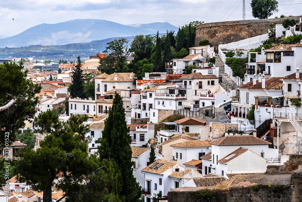 Beautiful aerial view city of Granada in a daytime. Granada - capital city of province of Granada, located at foot of Sierra Nevada Mountains. Granada, Andalusia, Spain.