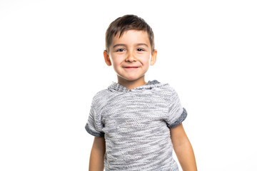 Boy having fun on studio white background