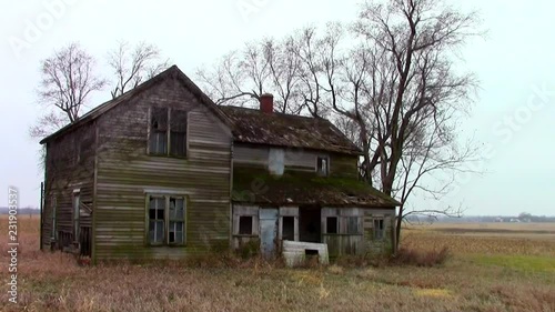 Abandoned farmhouse on the prairie photo