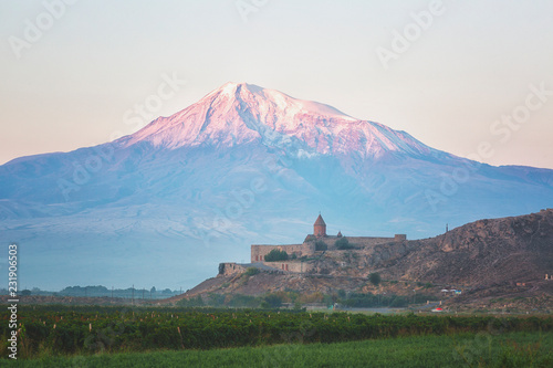 Ancient Armenian church Khor Virap  with Ararat in sunrise, Armenia photo