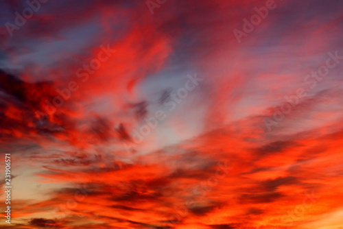 Fototapeta Naklejka Na Ścianę i Meble -  Dramatic sunset sky with blue and red clouds