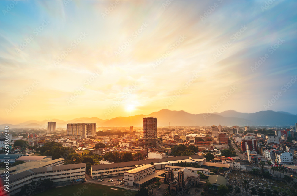 Aerial View of Ipoh Town during sunset.Soft Focus,Blur due to Long Exposure.Visible Noise due to High ISO.
