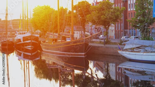 Boats or vessels on the Trave river. Embankment in Lubeck city. 