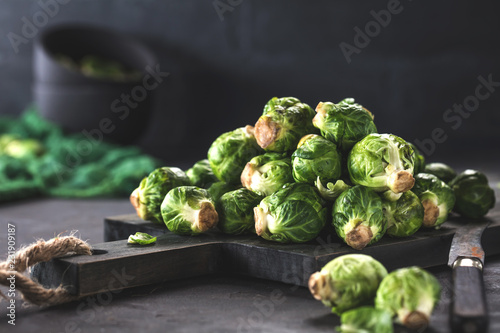 Fresh raw brussels sprouts on a wooden table