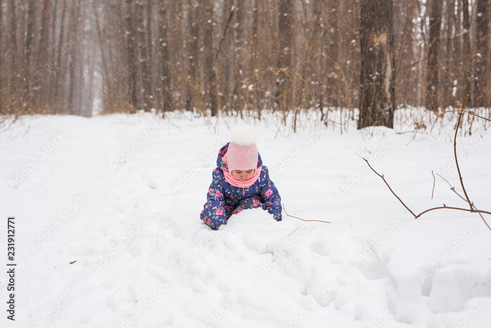 Child running in snowy forest. Toddler kid playing outdoors. Kid play in snowy park. Child running in snowy forest. Toddler kid playing outdoors. Kid play in snowy park.