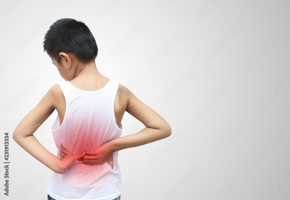 Asian kid with scoliosis, isolated on white background Asian kid with scoliosis, isolated on white background