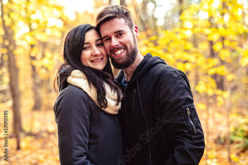 A Young couple having fun in the autumn park