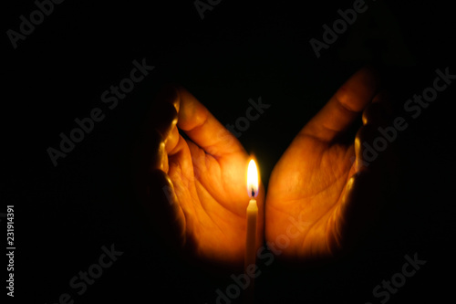 The hand that protects the candles in the dark