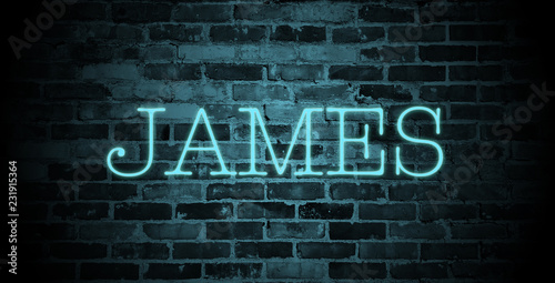 first name James in blue neon on brick wall