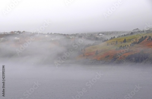 heavy fog over the ocean along the shoreline; Avalon Peninsula Newfoundland Canada 
