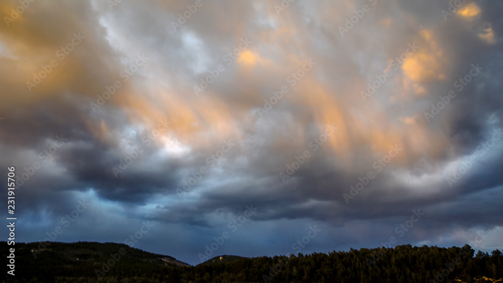 Obraz premium Storm over hills